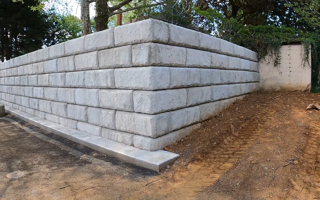 Custom retaining wall design and installation with white stone blocks in Springfield, MO